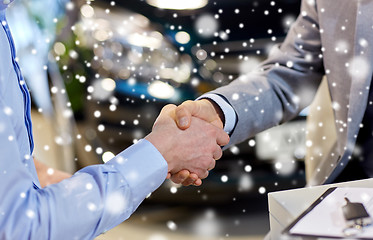 Image showing close up of male handshake in auto show or salon