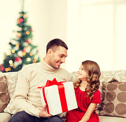 Image showing smiling father and daughter looking at each other