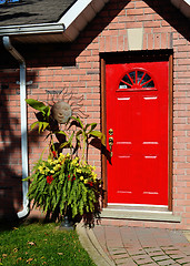 Image showing Red entrance door of a house.