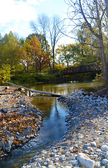 Image showing A small creek flow from a lake.