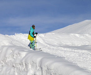 Image showing Skier on off-piste slope in sun day