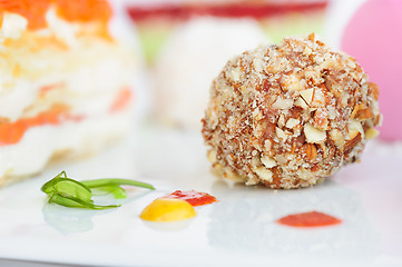 Image showing Unusiual nut ball with salmon sauce