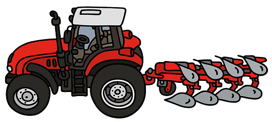 Image showing Tractor with a plow