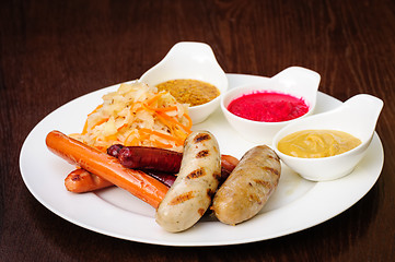 Image showing german sausages with cabbage