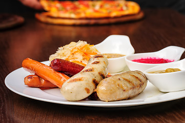 Image showing german sausages with cabbage