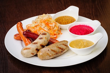 Image showing german sausages with cabbage