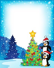 Image showing Frame with penguins near Christmas tree