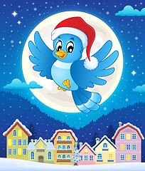 Image showing Christmas bird above town