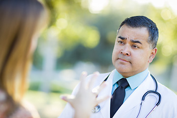 Image showing Hispanic Male Doctor or Nurse Talking With a Patient