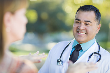 Image showing Hispanic Male Doctor or Nurse Talking With a Patient