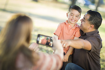 Image showing Mixed Race Family Taking A Phone Camera Picture