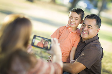 Image showing Mixed Race Family Taking A Phone Camera Picture