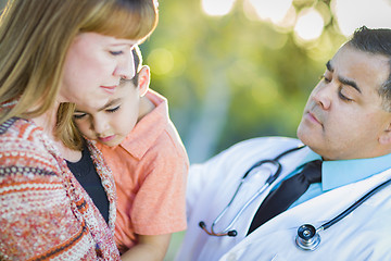 Image showing Sick Mixed Race Boy, Mother and Hispanic Doctor Outdoors