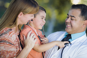 Image showing Mixed Race Boy, Mother and Doctor Having Fun With Stethoscope