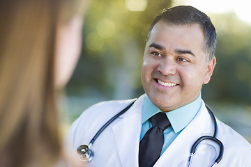 Image showing Hispanic Male Doctor or Nurse Talking With a Patient