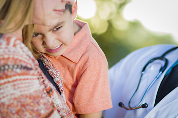 Image showing Sick Mixed Race Boy, Mother and Hispanic Doctor Outdoors