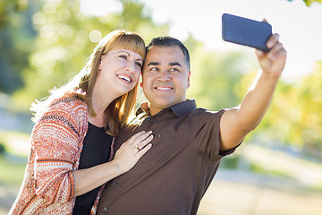 Image showing Attractive Mixed Race Couple Taking Self Portraits