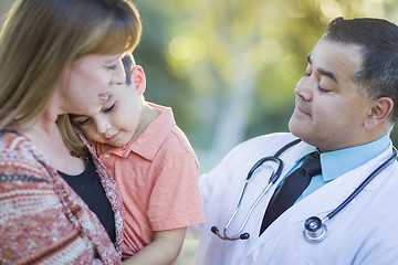 Image showing Sick Mixed Race Boy, Mother and Hispanic Doctor Outdoors