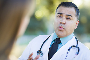 Image showing Hispanic Male Doctor or Nurse Talking With a Patient