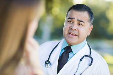 Image showing Hispanic Male Doctor or Nurse Talking With a Patient