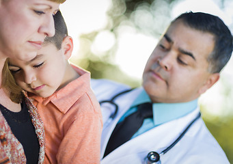 Image showing Sick Mixed Race Boy, Mother and Hispanic Doctor Outdoors