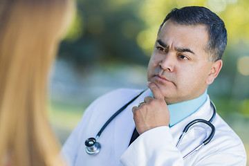 Image showing Hispanic Male Doctor or Nurse Talking With a Patient