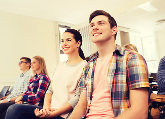 Image showing group of smiling students in lecture hall