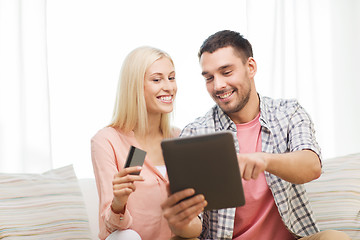 Image showing happy couple with tablet pc and credit card