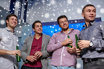 Image showing group of male friends with beer in nightclub