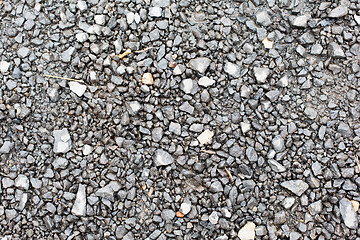 Image showing close up of gray macadam stones on ground