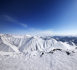 Image showing Winter snowy mountains and blue sky