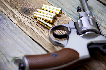 Image showing vintage revolver with cartridges