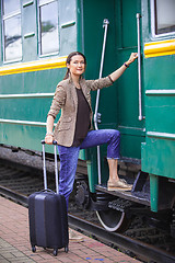 Image showing woman at the door of an old railcar