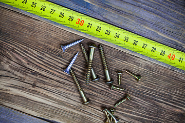 Image showing screws and measuring tape