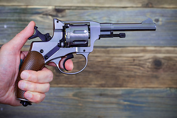 Image showing revolver gun in a human hand