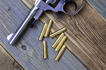 Image showing Vintage revolver Nagant and the seven golden cartridges