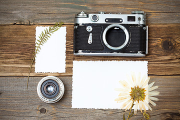 Image showing vintage camera, old lens and pressed flower