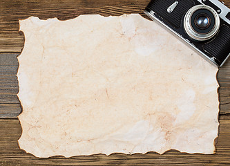 Image showing blank sheet of old paper and vintage camera