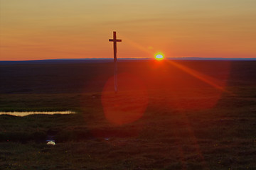 Image showing Old, cross, on, backdrop, of, setting, sun., A, night, in, the, Polar, day, Novaya, Zemlya, archipelago., Arctic