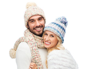 Image showing smiling couple in winter clothes hugging