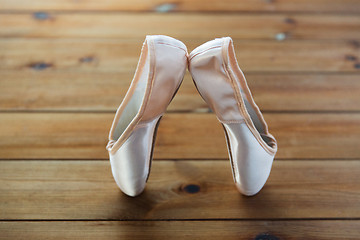 Image showing close up of pointe shoes on wooden floor