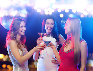 Image showing smiling women with cocktails at night club