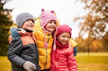 Image showing group of happy children hugging in autumn park