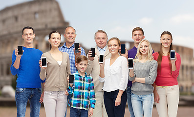 Image showing group of people with smartphones over coliseum