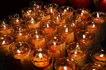 Image showing Temple candles in transparent chandeliers