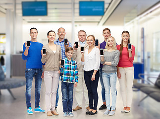 Image showing group of smiling people with smartphones