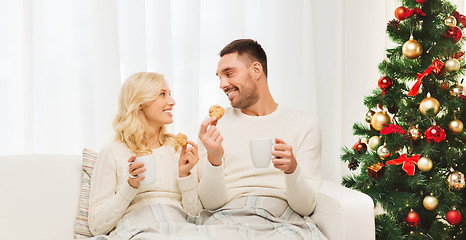 Image showing happy couple at home with christmas tree