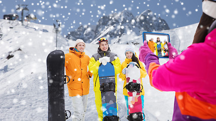 Image showing happy friends with snowboards and tablet pc