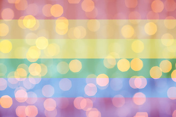 Image showing blurred golden lights over rainbow flag background