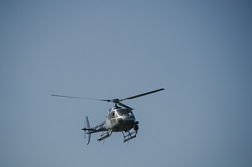 Image showing one helicopter on a blue sky